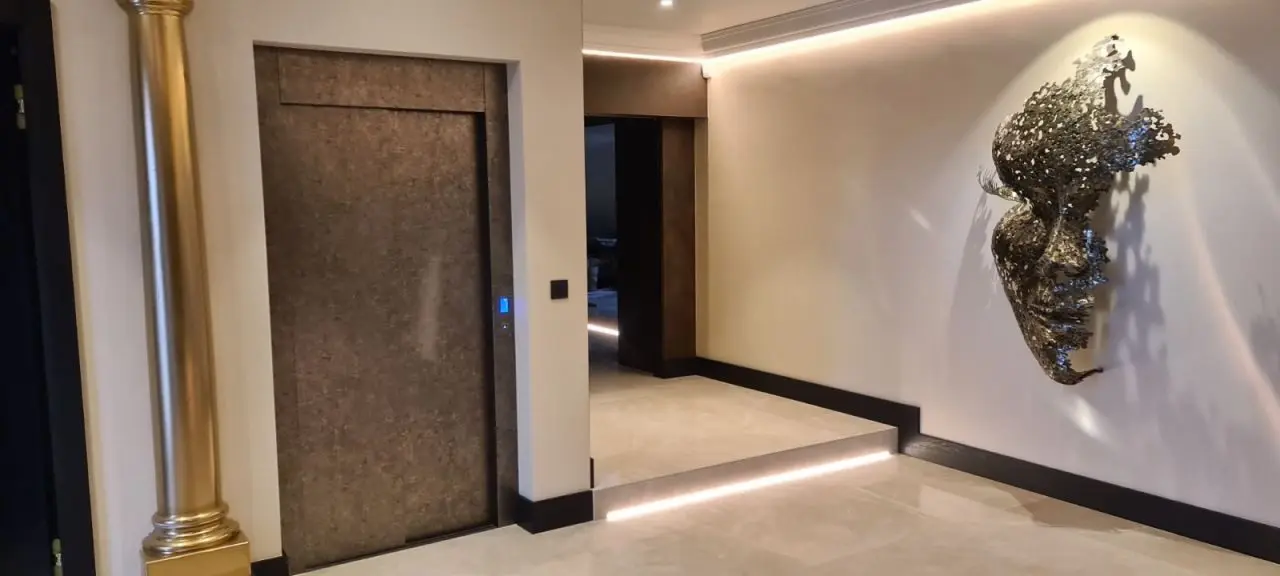 A door way with a mirror and lights in the middle of it