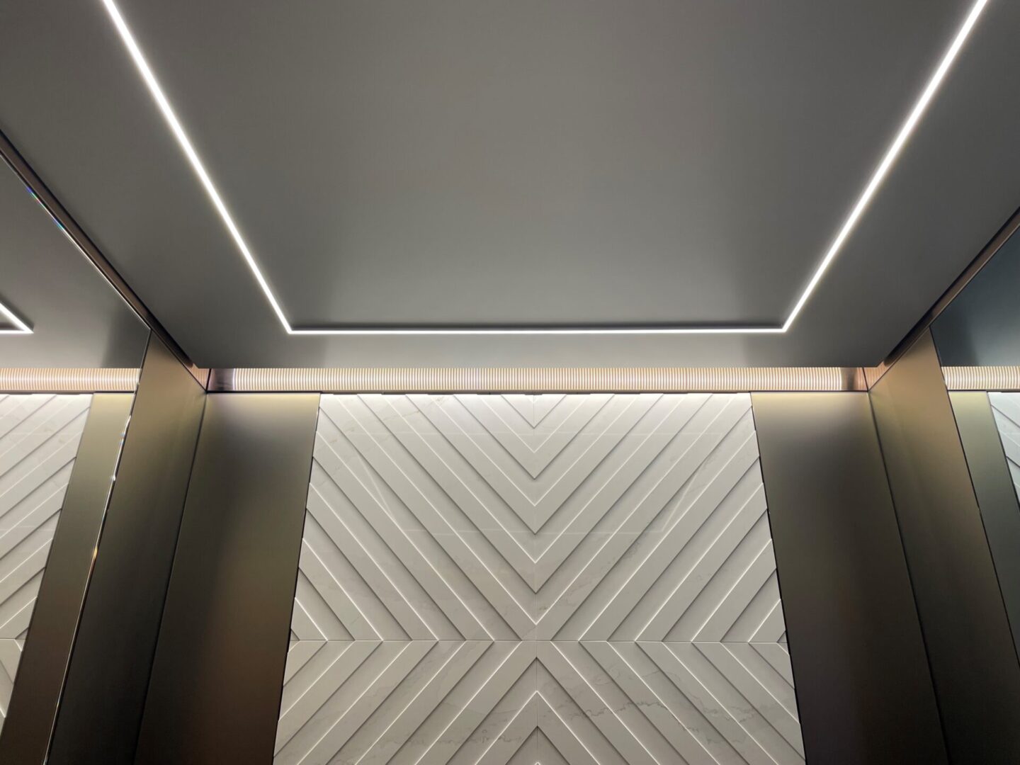 A view of the ceiling in an elevator.