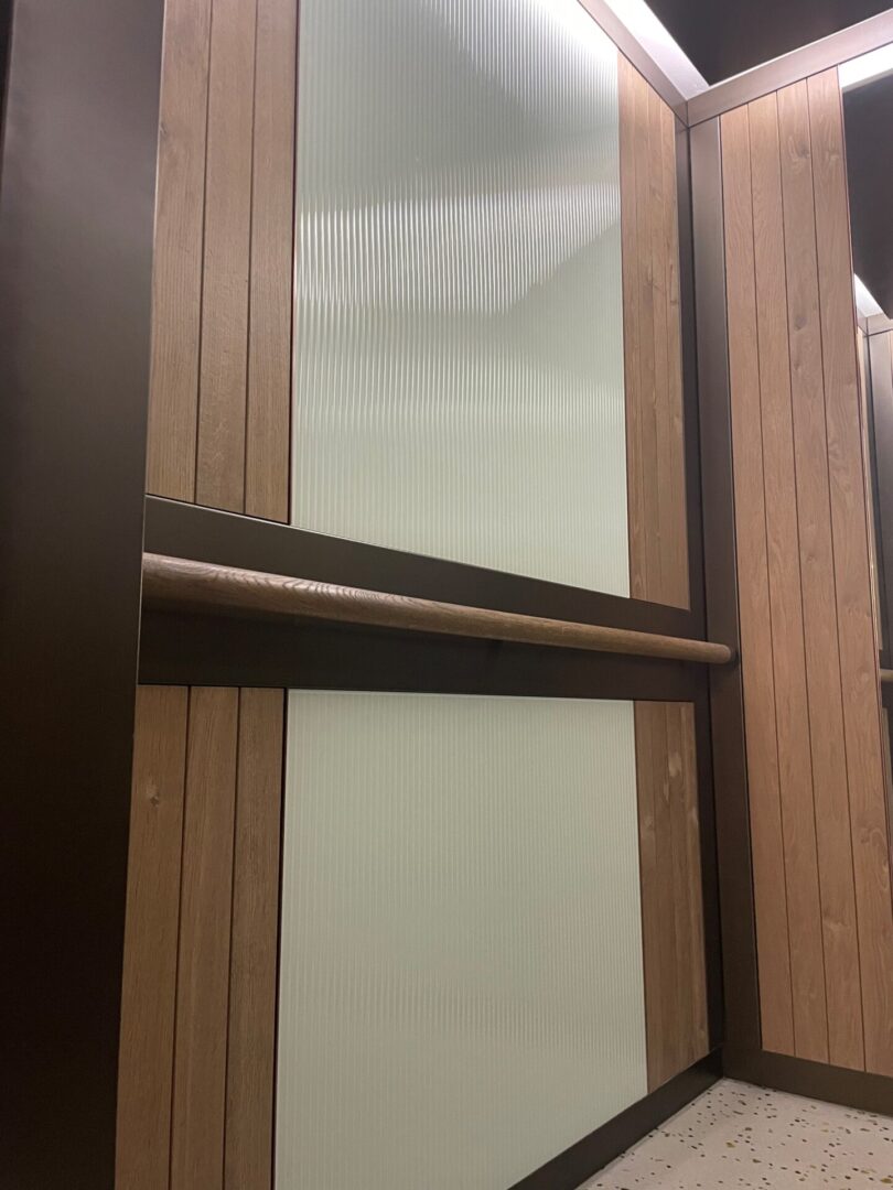 A wooden door with two glass panels on it.