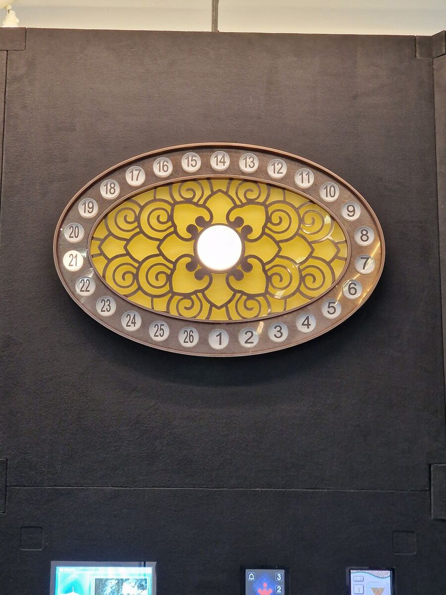 A yellow and white plate on the wall