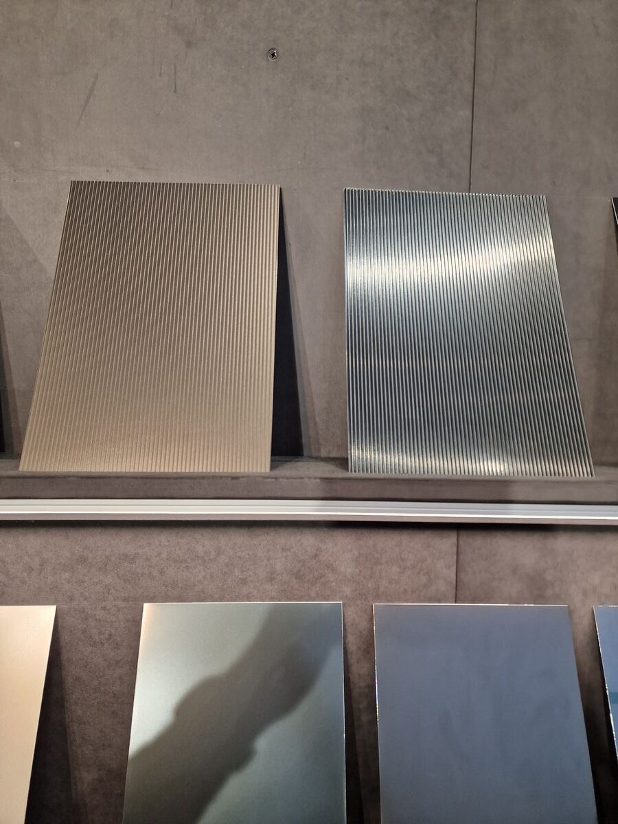 A row of metal sheets on display in a store.