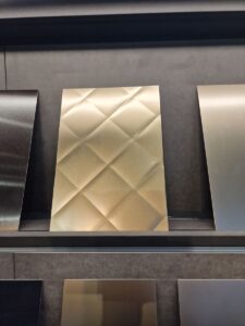 A shelf with different types of metal surfaces.